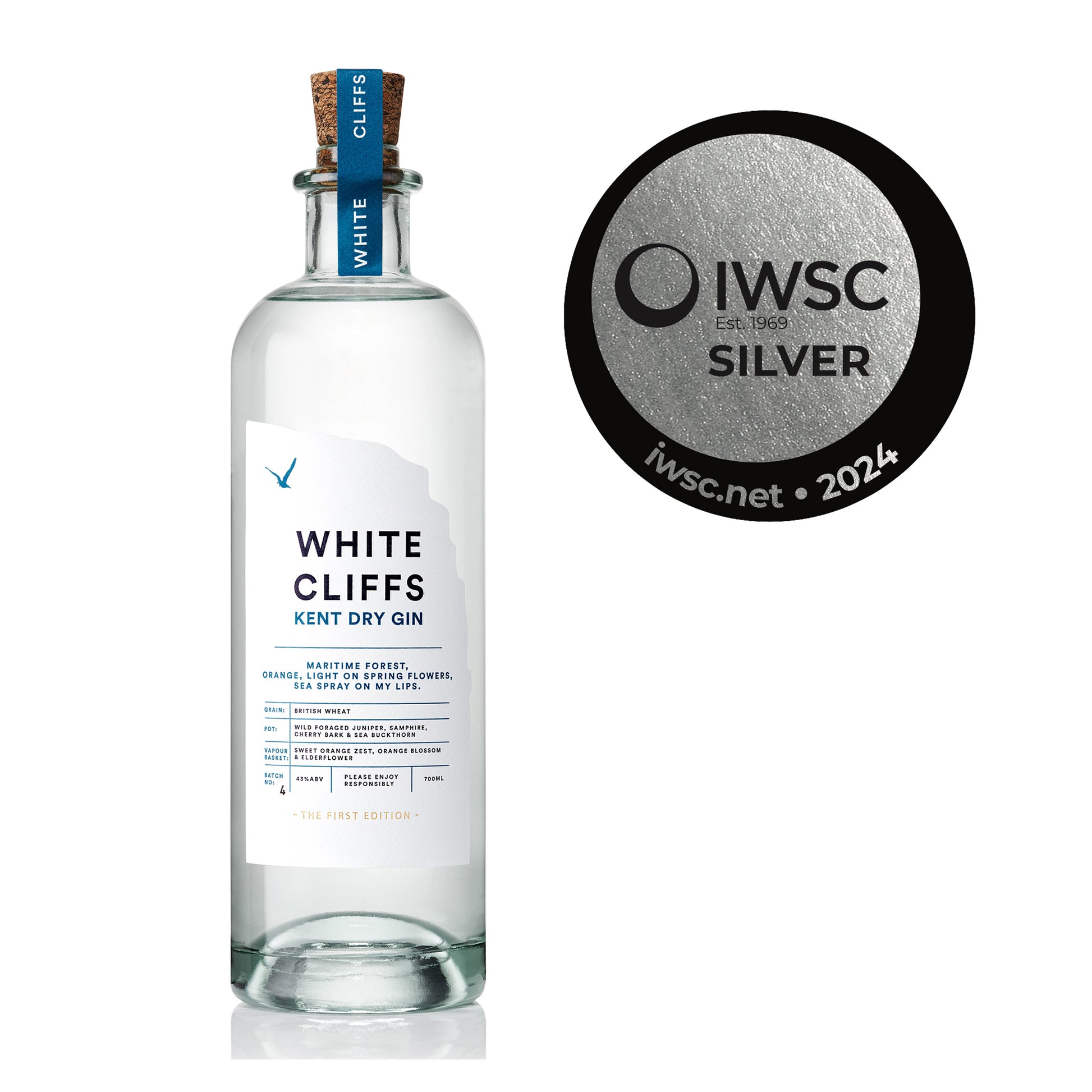 Bottle of White Cliffs Gin by Pleasant Land Distillery with coastal botanical design and IWSC silver award