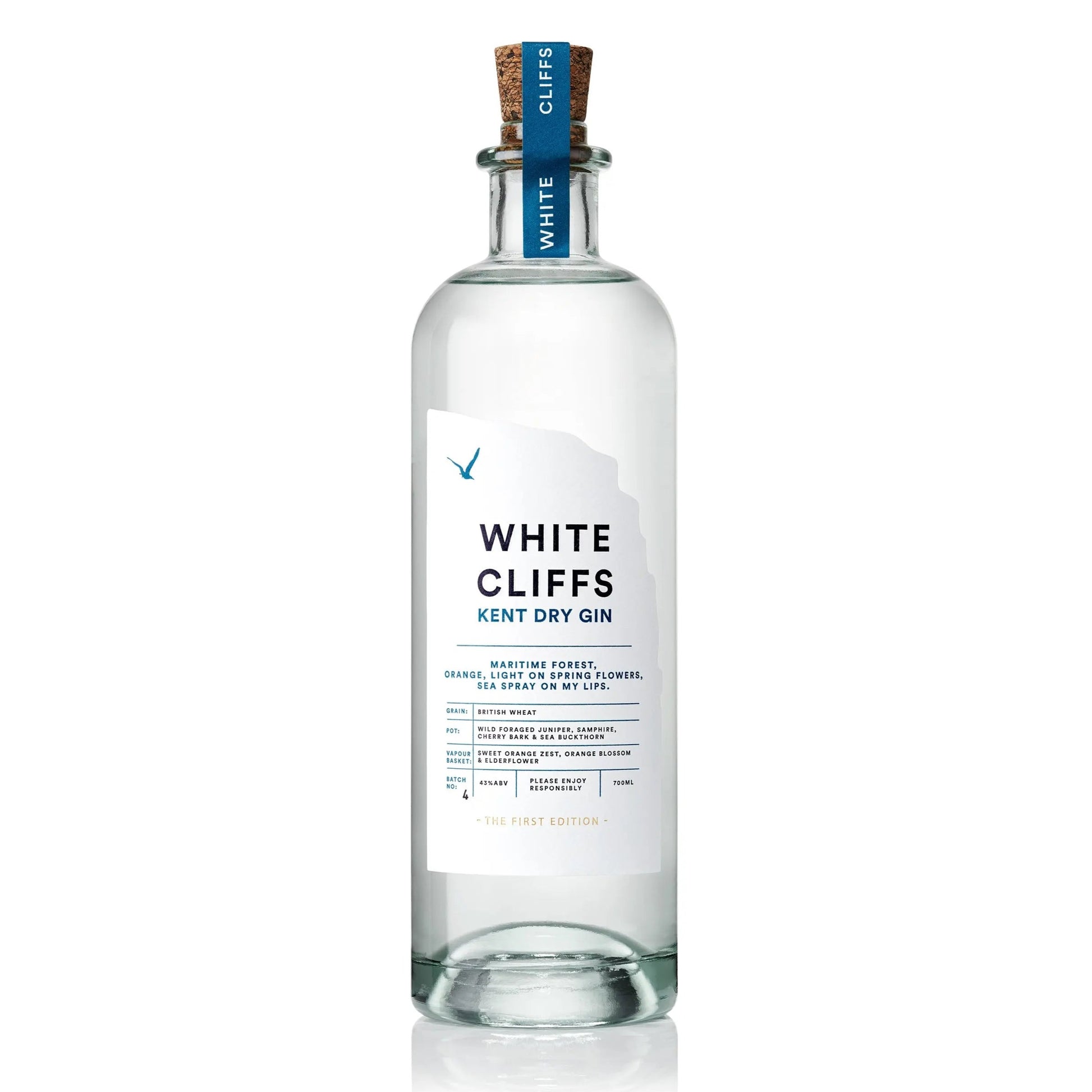 Bottle of White Cliffs Gin by Pleasant Land Distillery with coastal botanical design